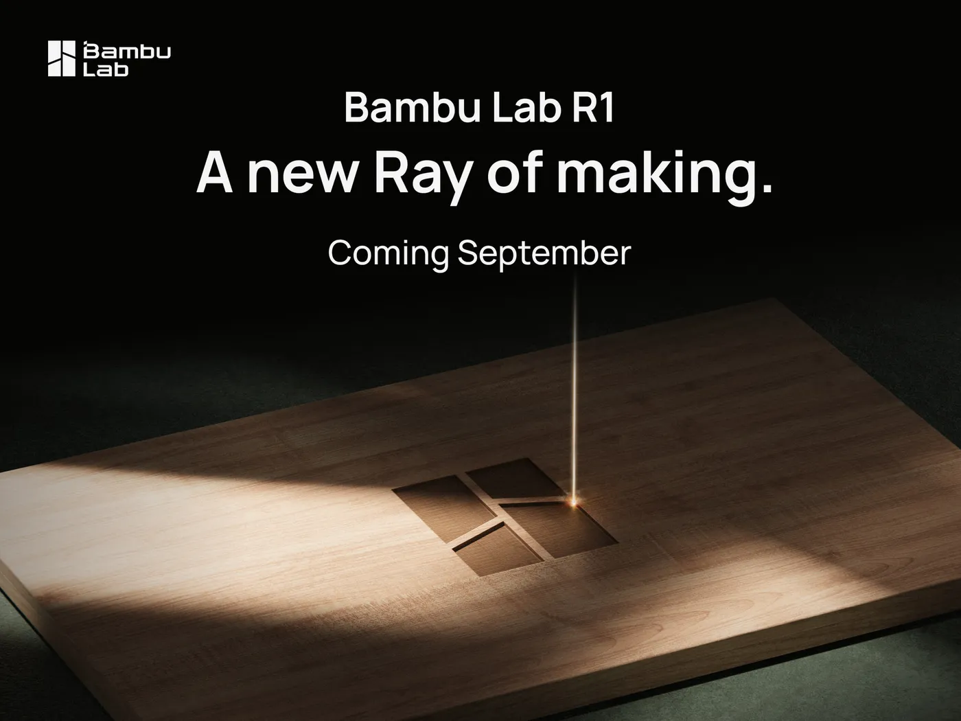 Bambu Lab R1 teaser image: a laser beam cutting the Bambu Lab logo into a wood board, with the tagline A new Ray of making, coming September